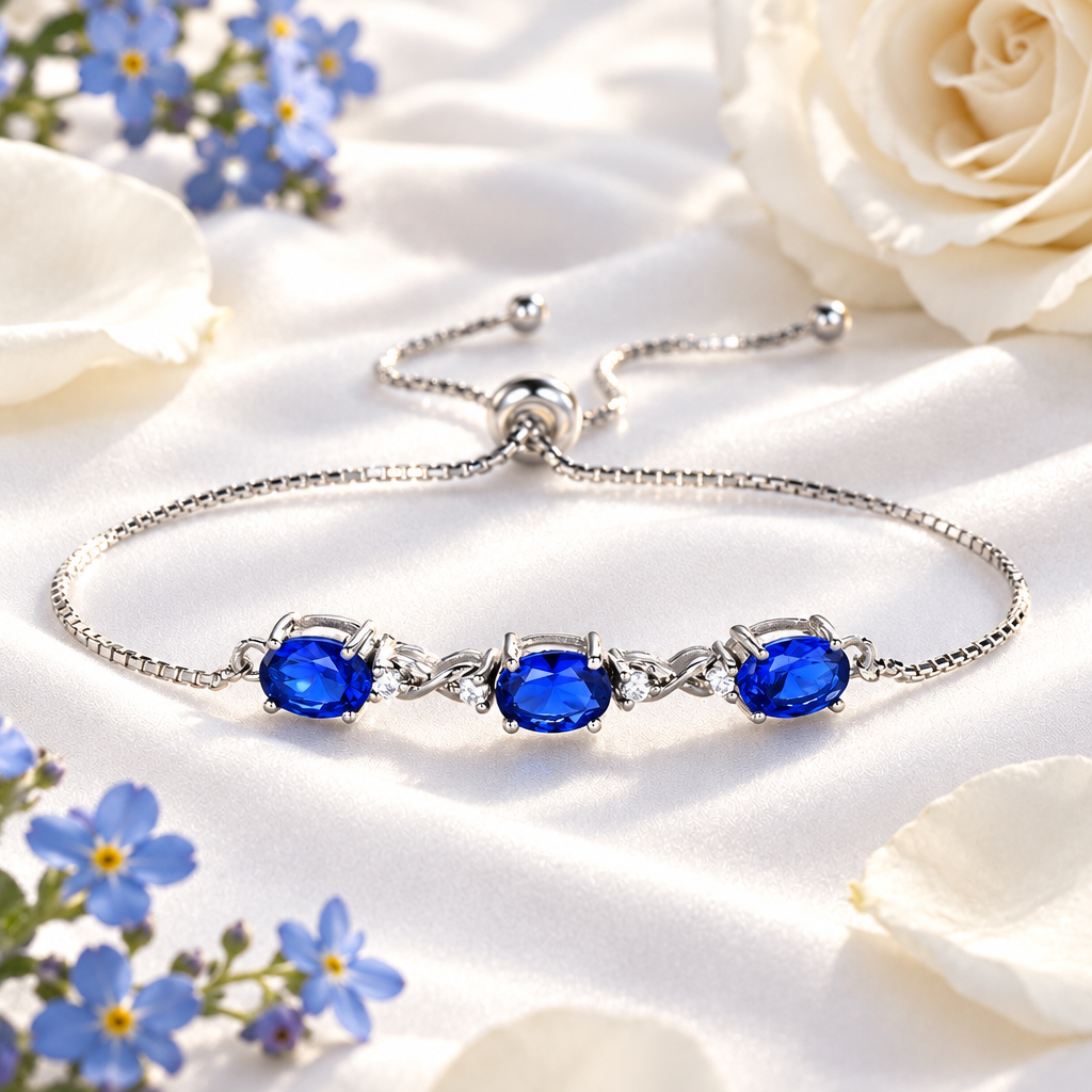 Bracelet tanzanite bleu sur soie blanche, ambiance luxe Kylara